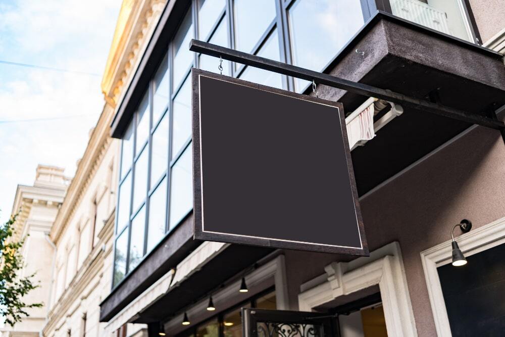 (A signage board is shown in the image placed above the shape to make it even more visible)
Factors to Consider When Choosing Shop Front Signage