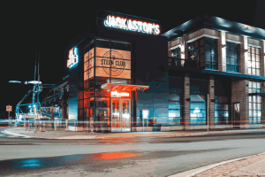 (This image is showing an Outdoor neon sign on front of a store)